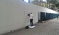 Tbilisi, Georgia — Georgian artist making a stencil graffiti on Chavchavadze st..jpg