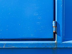 Hinge on blue dumpster.jpg